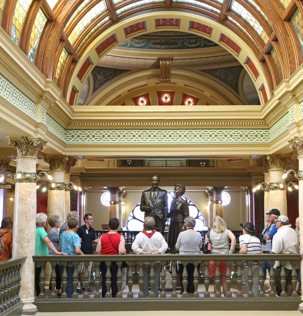 Adults enjoy a tour in the Montana Capitol